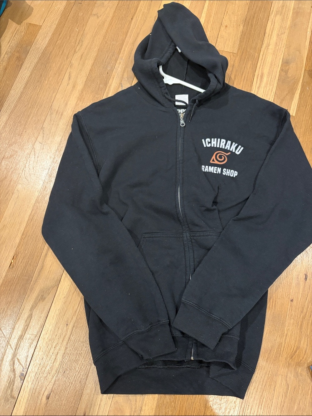 Ripple Junction Black Hoodie with Orange Graphic
